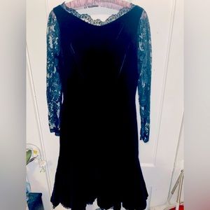 Vintage black velvet and lace backless dress w/a ruffle hem.